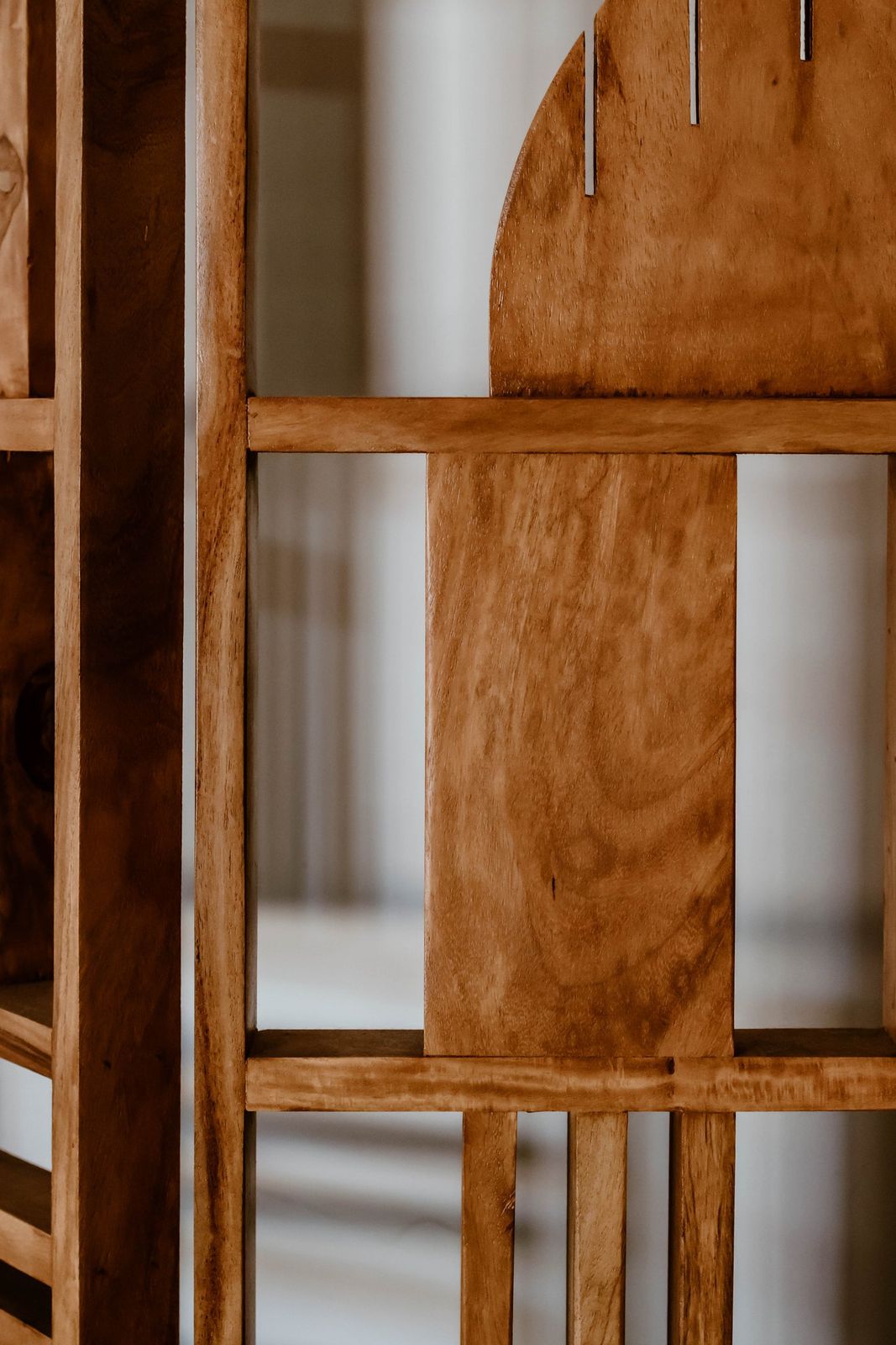 The timber screen in the practice, with the room softened behind it