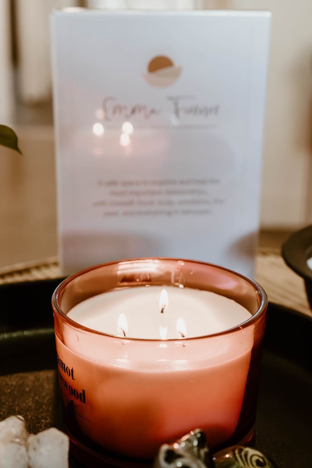 A softly lit candle in the practice room