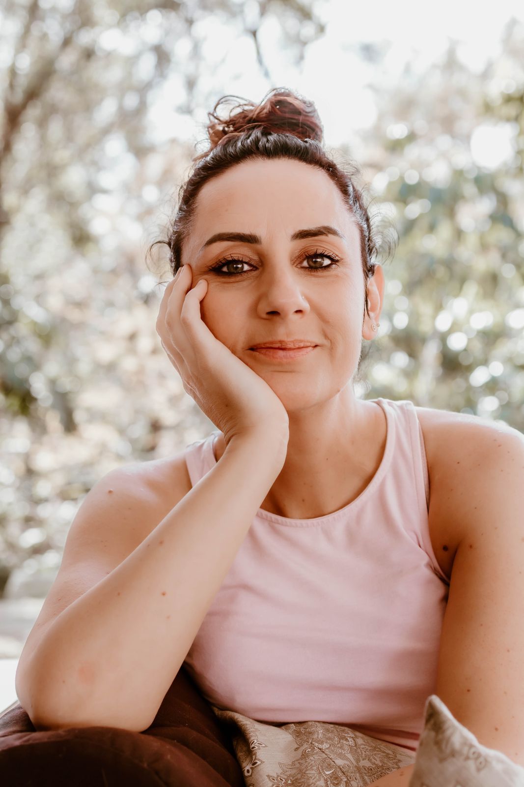 Emma Furner smiling, resting her chin on her hand